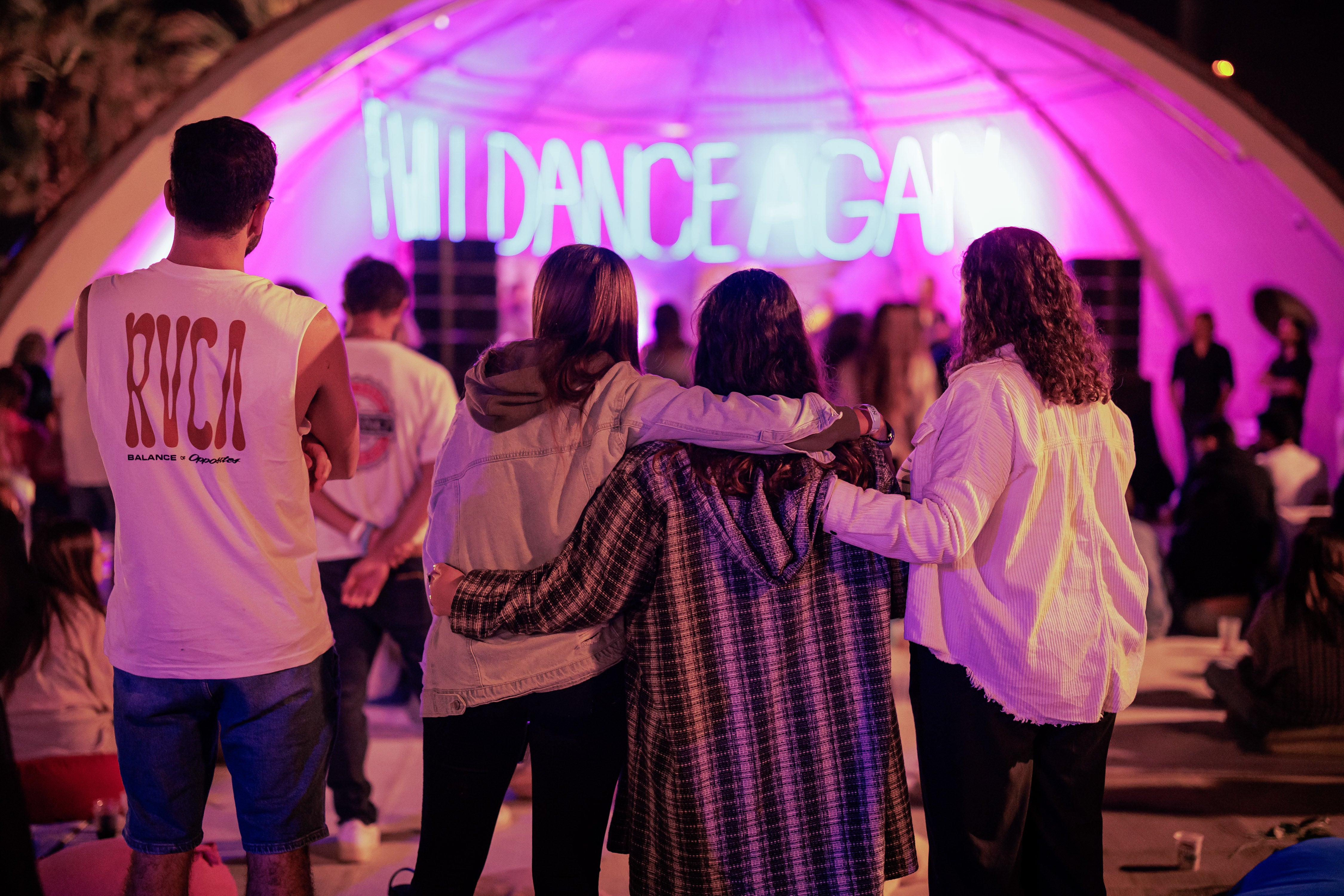 The Nova community gathering and dancing together